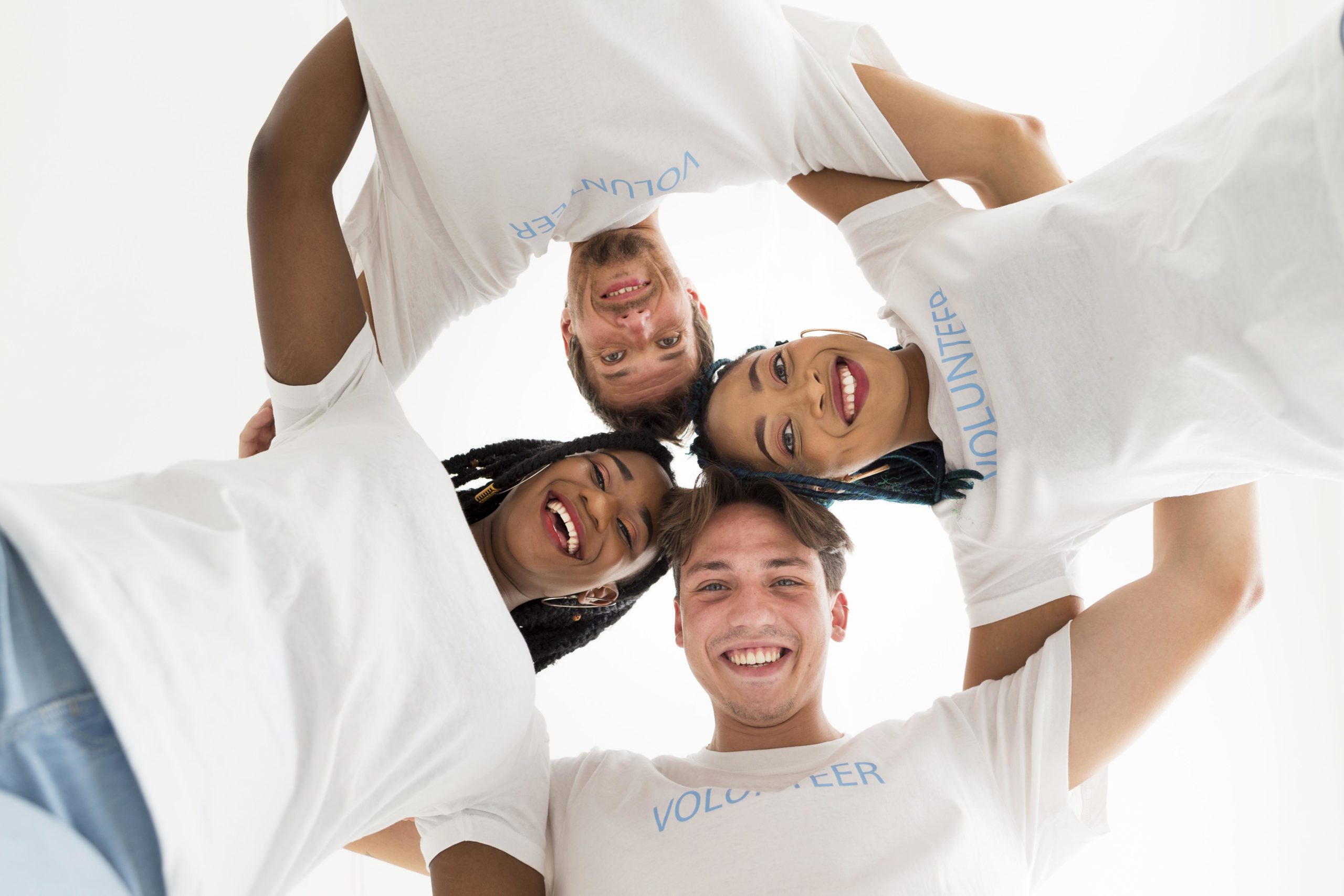 volunteers group hug