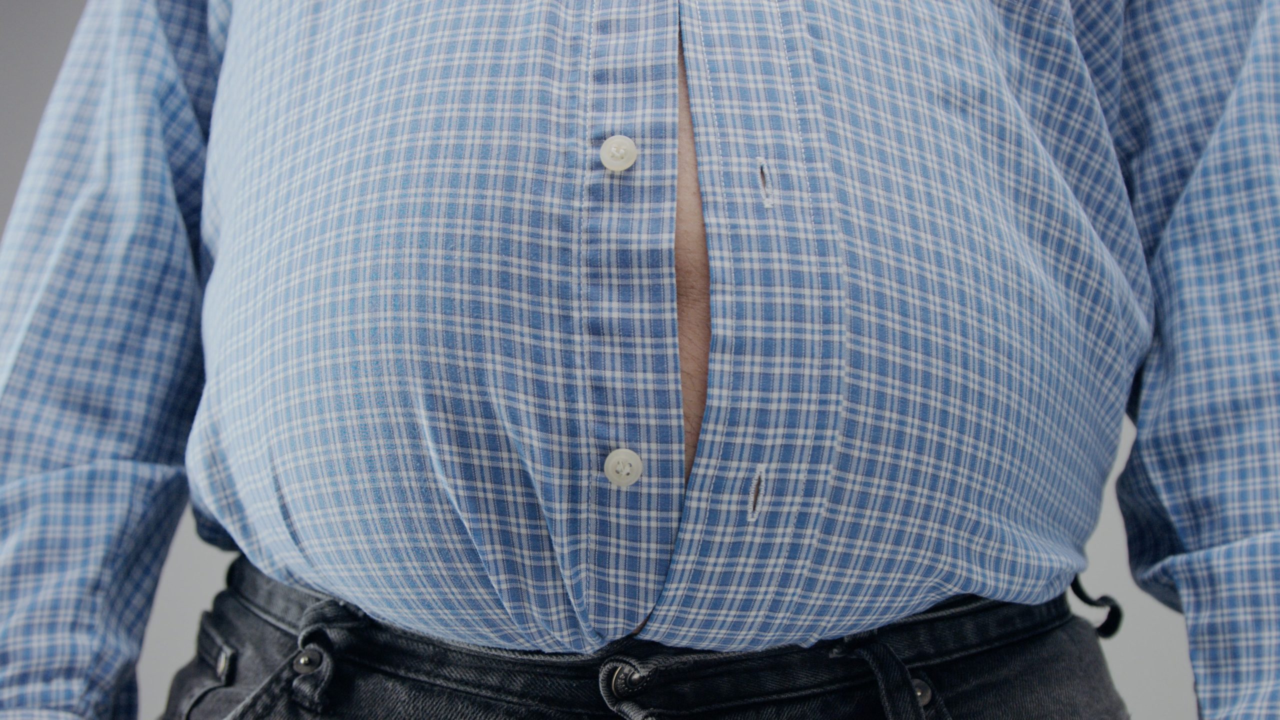 obese man with a shirt too small